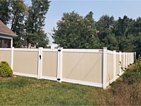 <b>Two toned tan and white vinyl privacy fence with single walk gate</b>